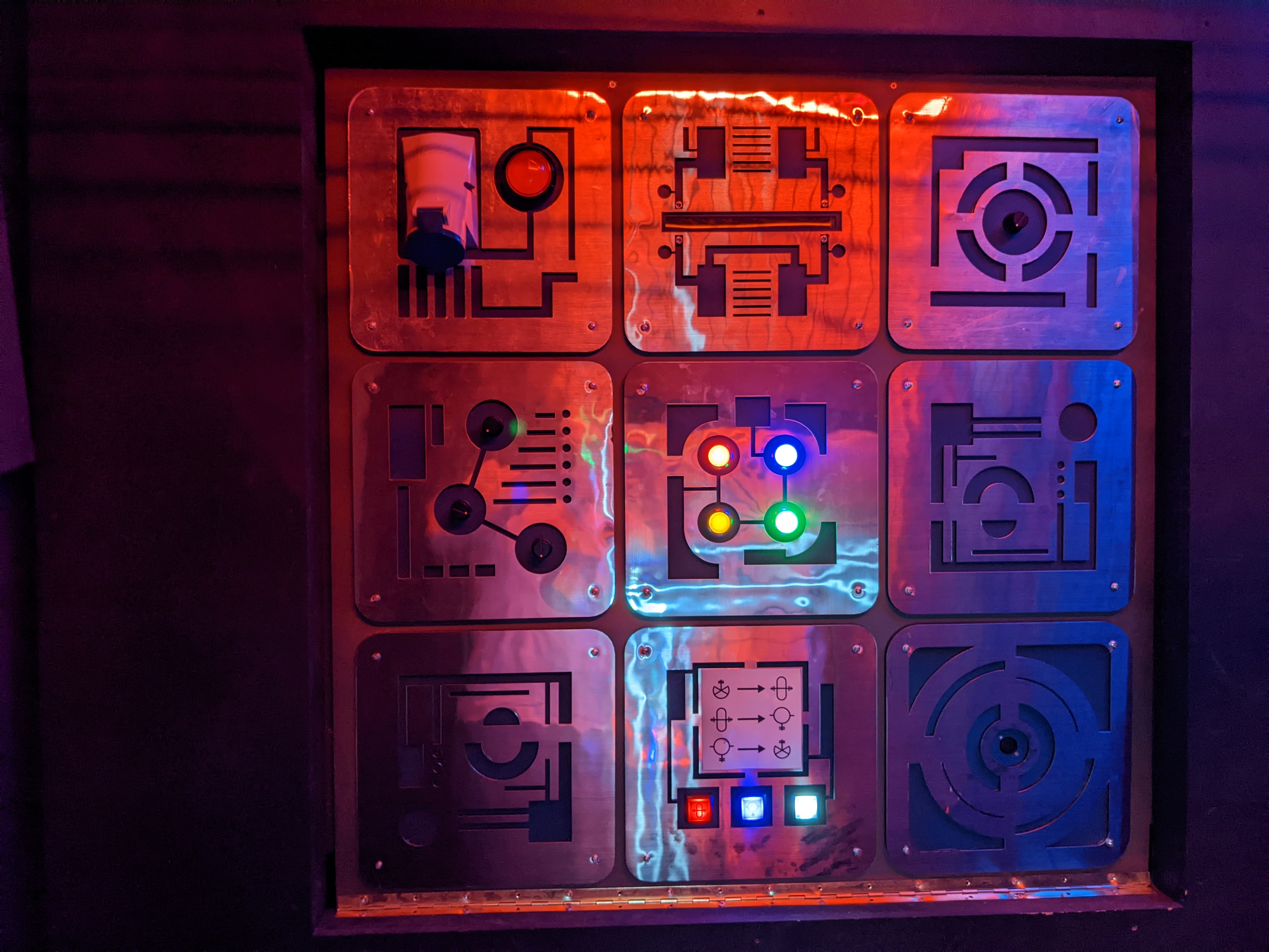Mechanical puzzle wall, custom-cut metal plates